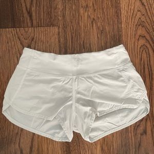 White low rise Lululemon shorts.